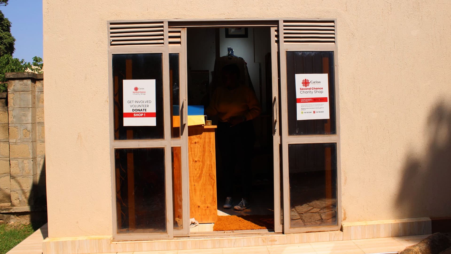 Displayed goods and pre-loved items at the Caritas Kampala Charity Shop